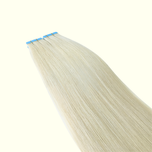 Blonde hair extensions with blue clips on a white background
