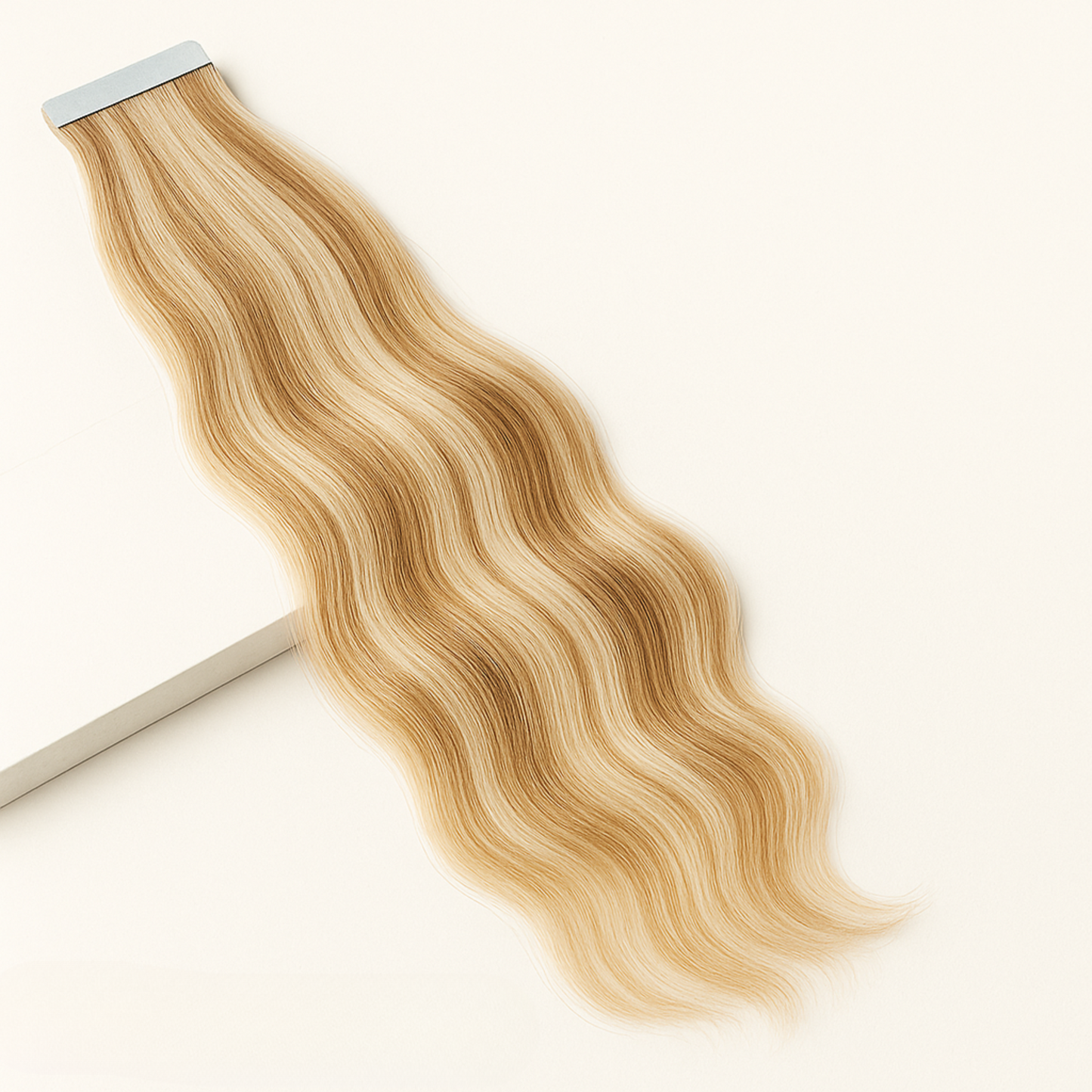 Blonde hair extensions on a white background
