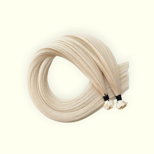 Blonde hair extensions on a white background